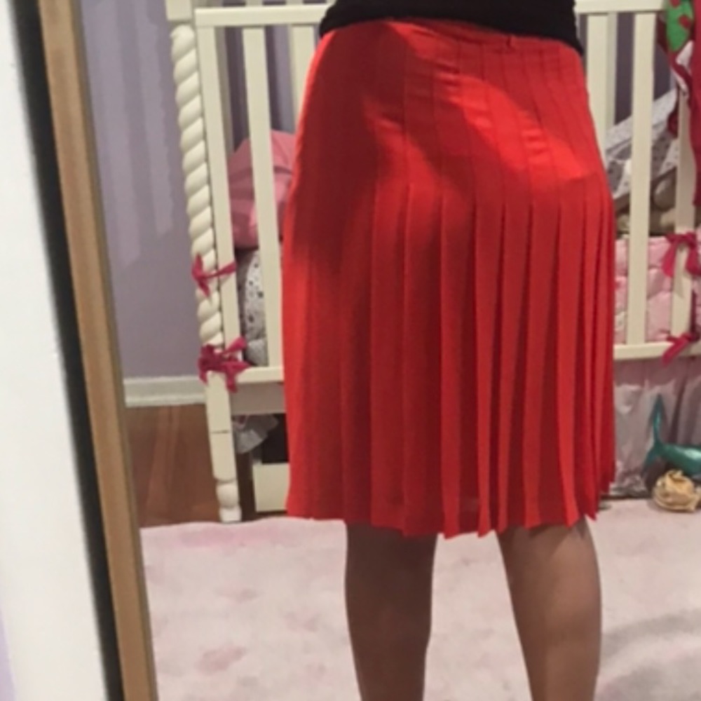 Pleated red/orange skirt